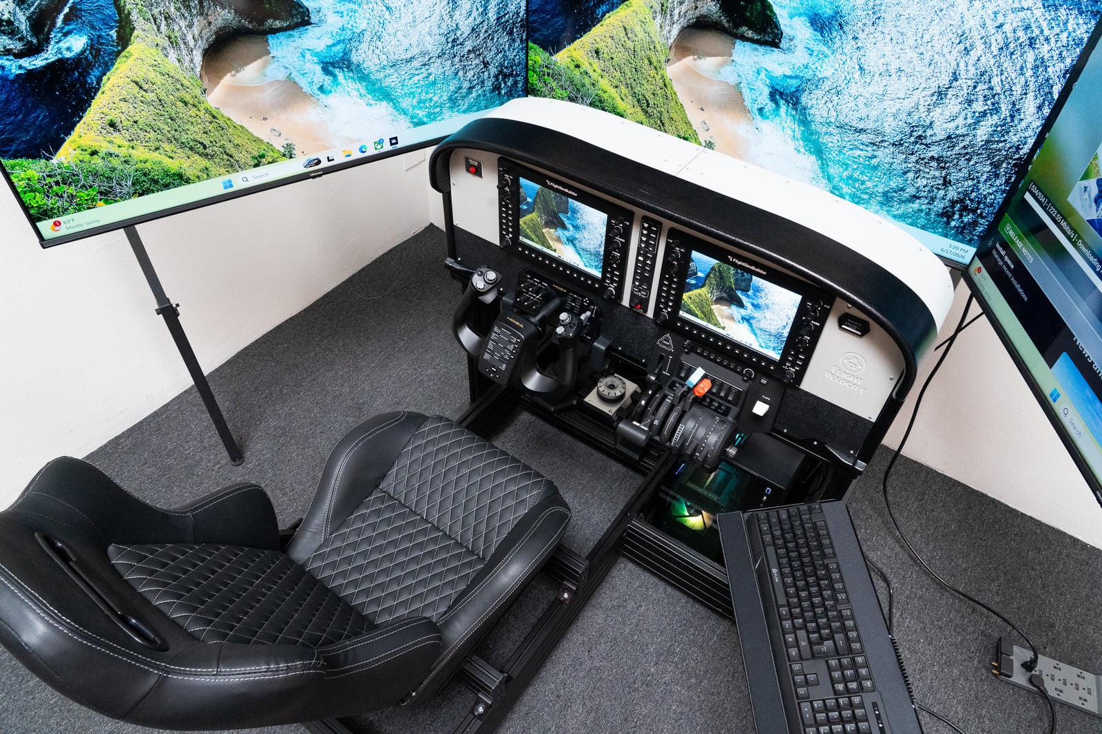 Triple display flight simulator setup on a floor stand surrounding a Cessna-style G1000 cockpit panel